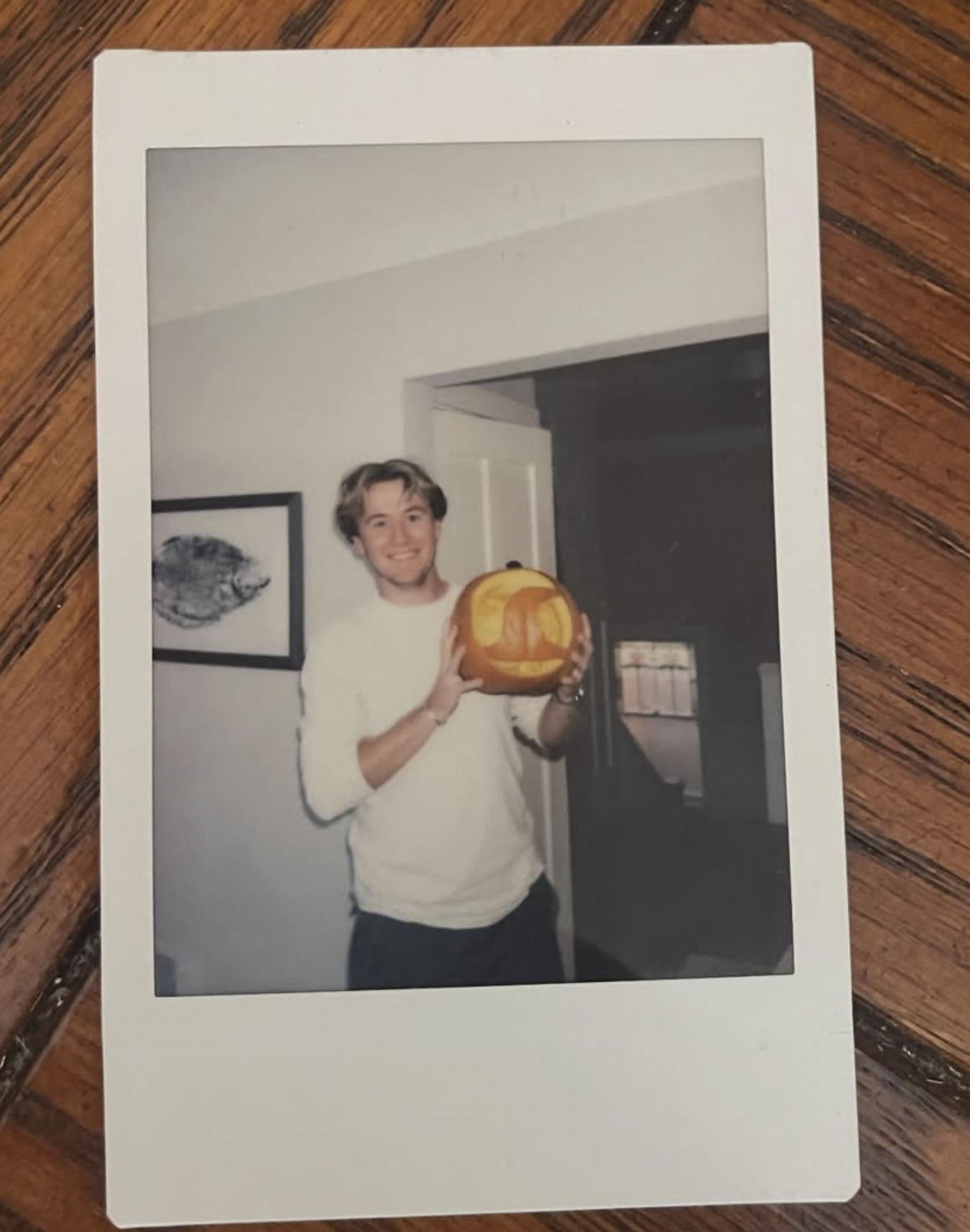 Dominic holding a carved pumpkin